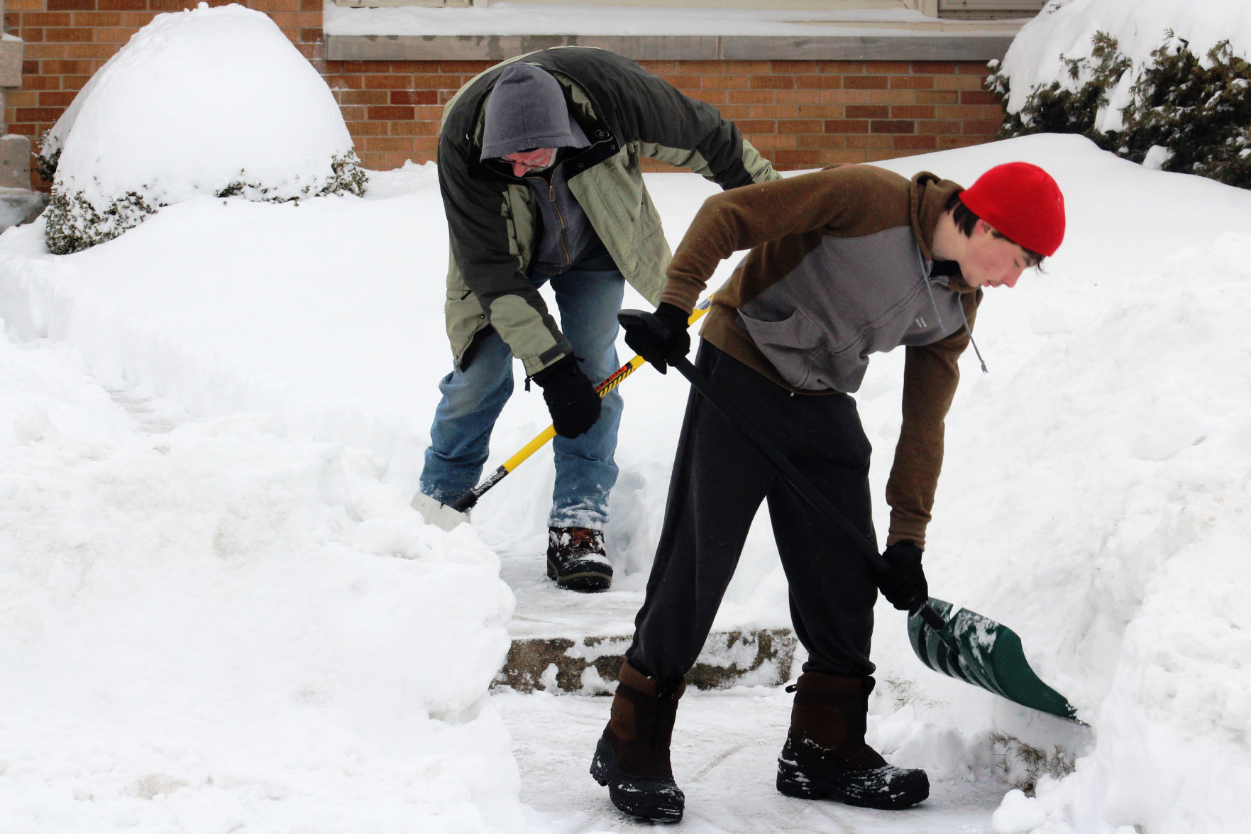 Father and son fight the snow